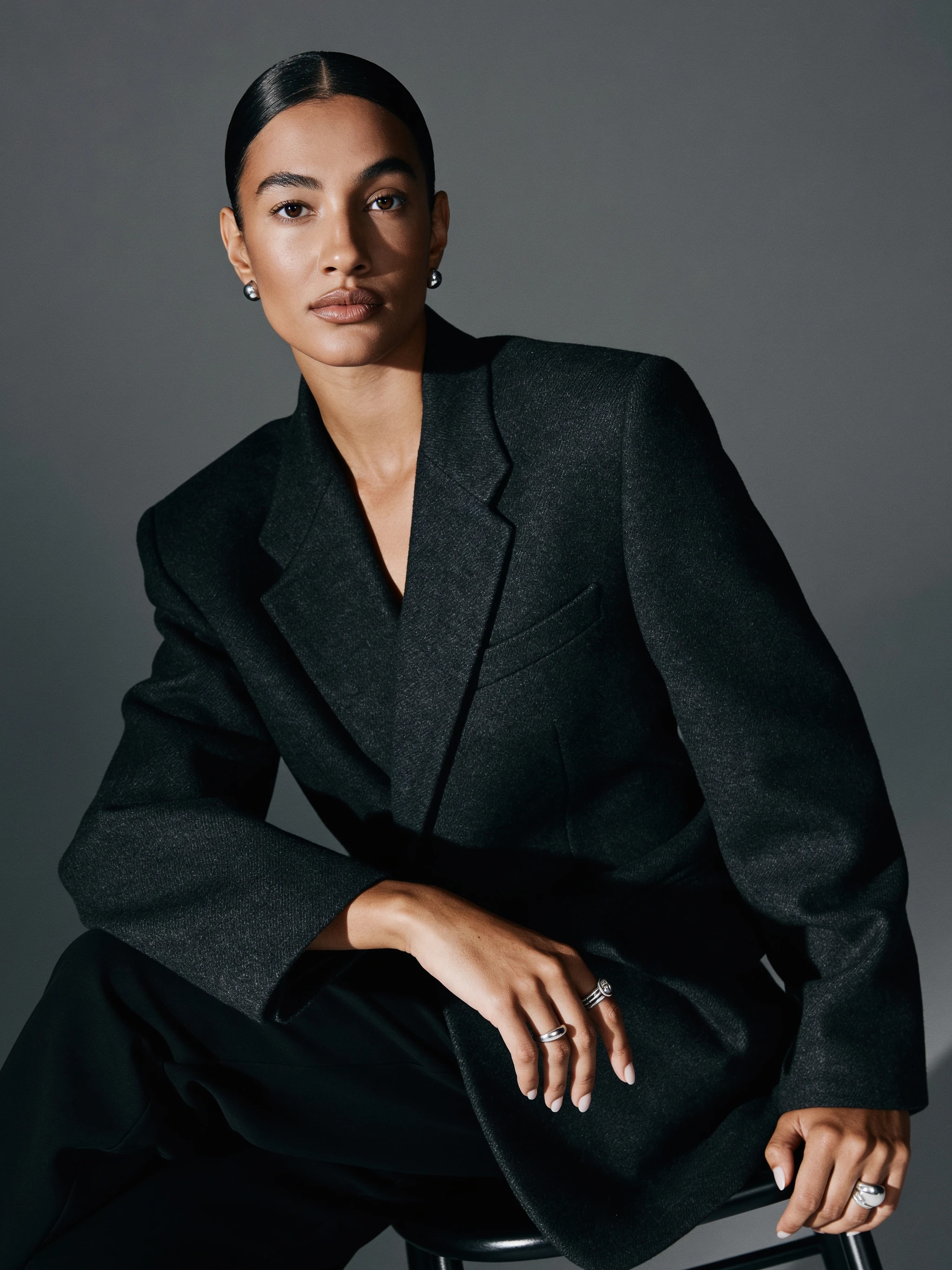 Model wearing a structured black jacket